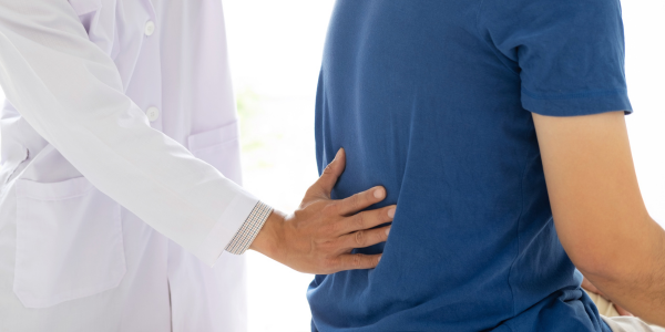 Understanding Spondylolisthesis: Symptoms, Causes, & Treatment